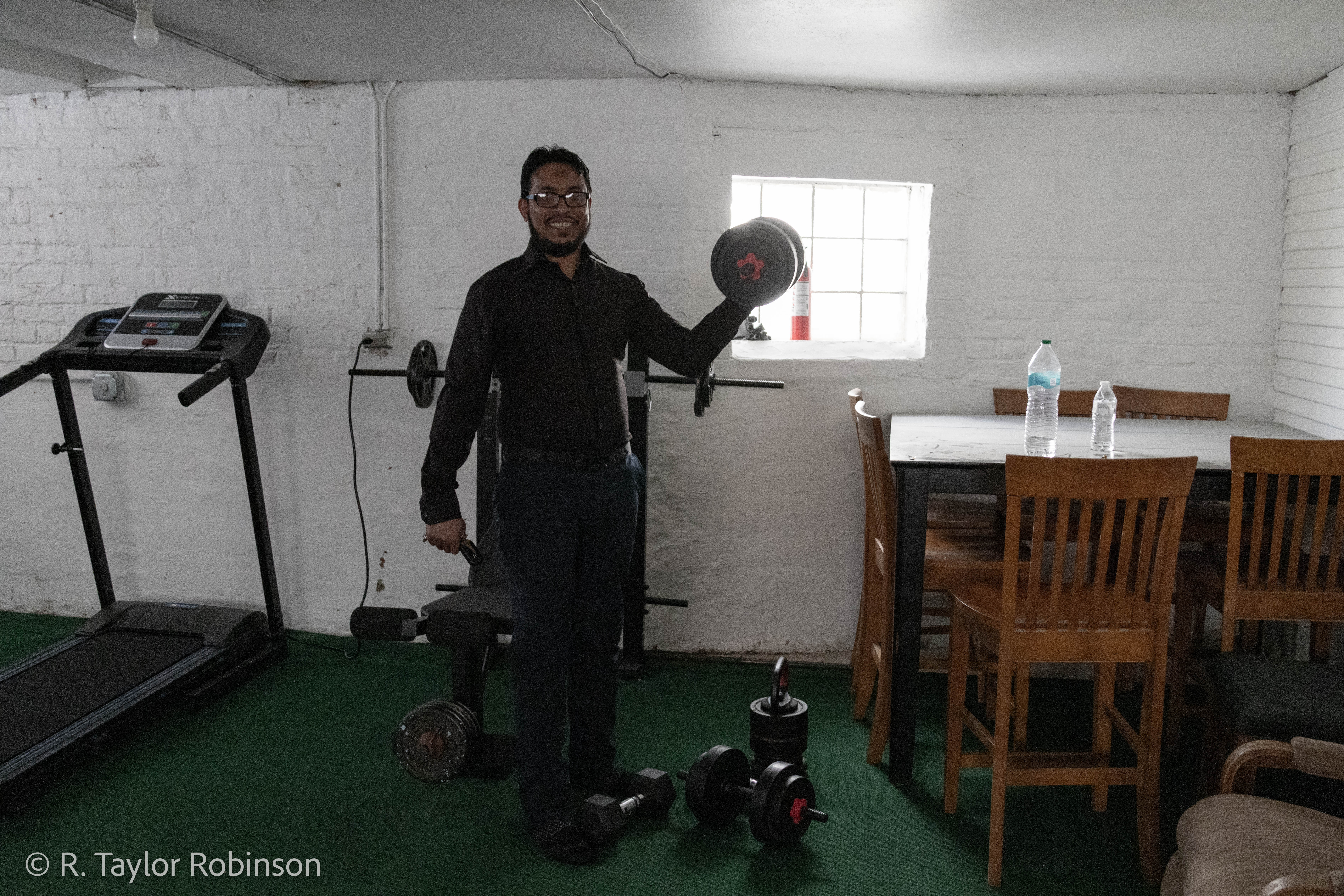 Kamal shows off his at-home gym in his basement, he said he only pays $1,400 a month for his mortgage on the three story home, which is conveniently located only a few blocks from ICNA and across the street from his kids’ school. He said school in Myanmar costs money, there are no free public schools and his father had to save up and sell cattle to make sure Kamal was able to graduate. If he stayed in Bangladesh he said he would have to work manual labor jobs, out of respect for his father’s effort to educate him he decided to embark for Malaysia.