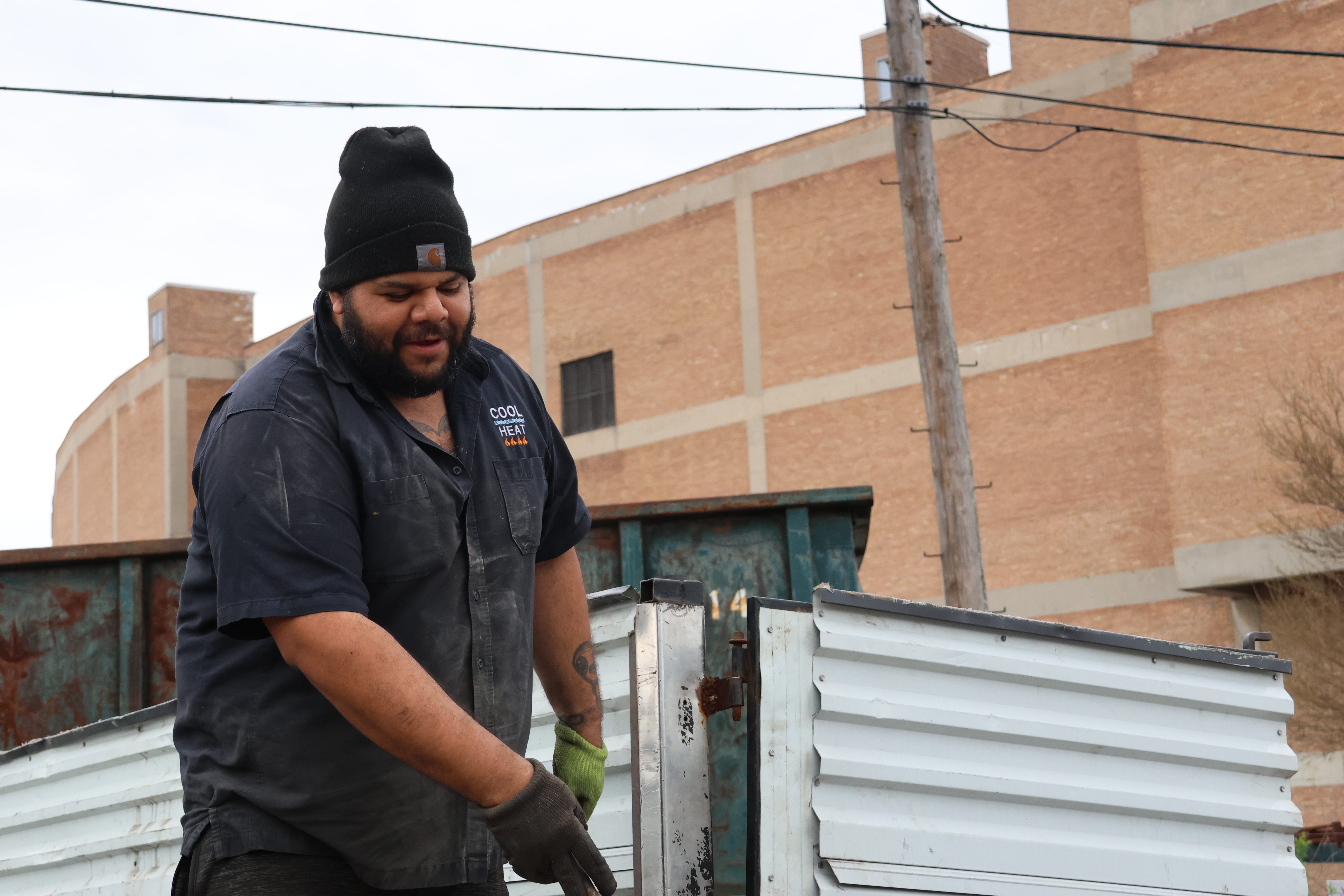 Fernando Florian Jr., 36, is Florian’s son and he goes by junior. He hands his father another piece of metal from the truck.
