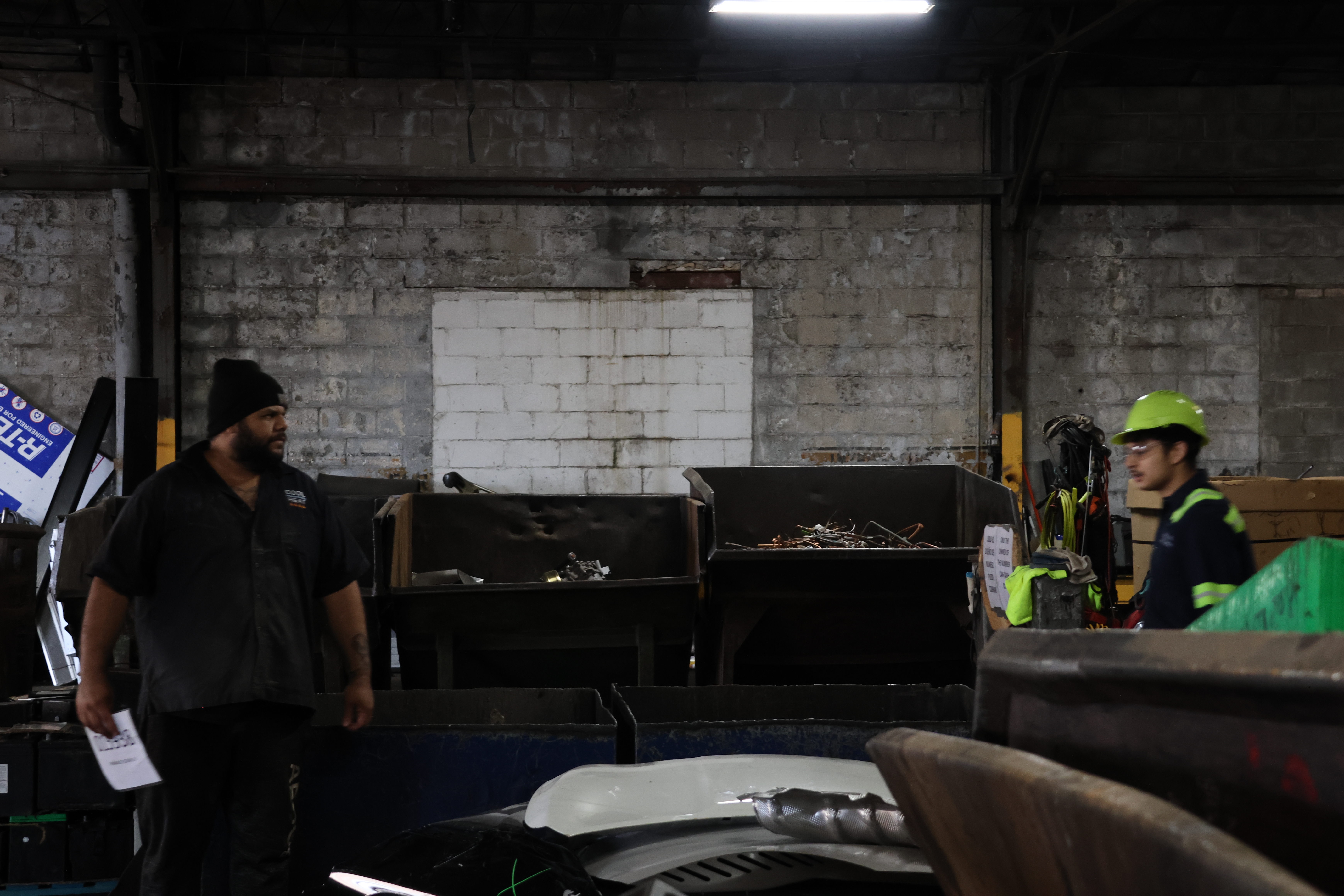 Estrada weighs the Florians’ car parts as Junior holds his scrapyard membership card. Estrada has been working at Windy City Iron & Metal for two years. "I started right after high school," he said. "College wasn’t for me."