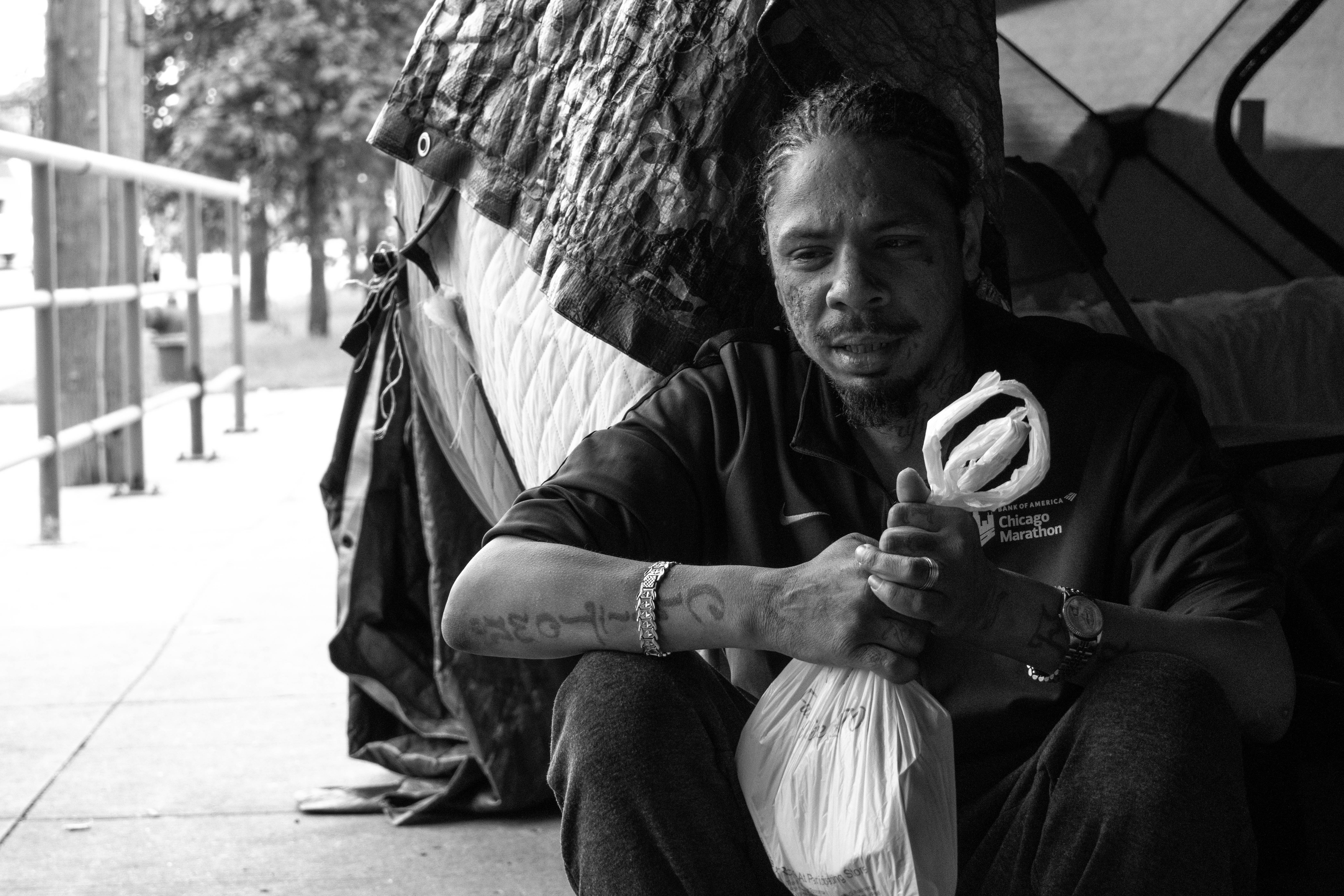 Israel Gonzalez in front of his tent